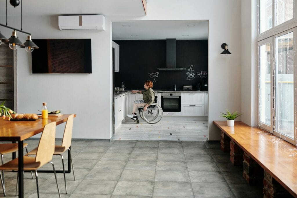 photo of woman sitting on wheelchair